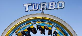 Roller Coaster Underneath a Sign That Reads Turbo